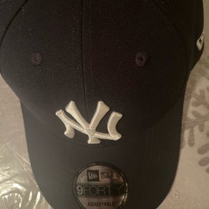 Selling a New York Yankee hat.